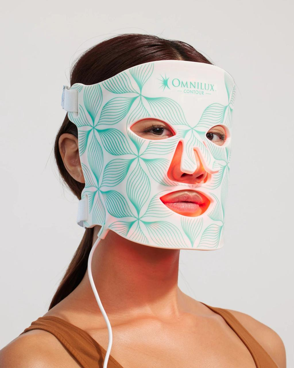 Model wearing the Omnilux Contour Face LED Mask during treatment